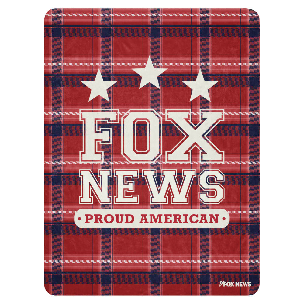 A *FOX News* Proud American Blanket draped over a clean sofa in a modern American living room.