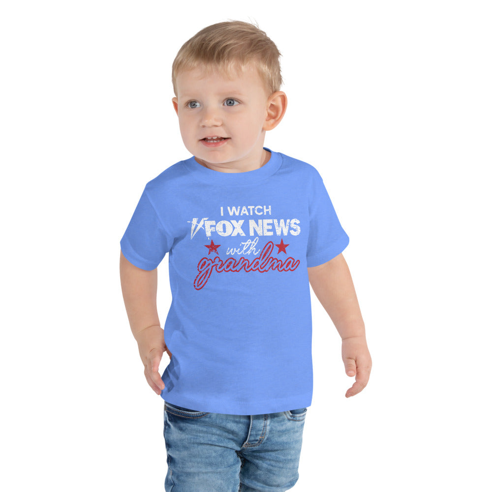 Close-up of the crisp FOX News logo and graphic text on a white toddler t-shirt.