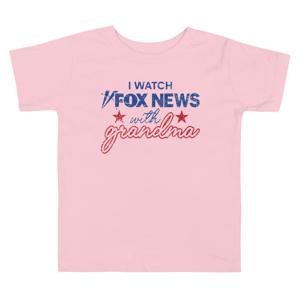 A Heather Columbia Blue toddler tee featuring the official FOX News I Watch with Grandma design.
