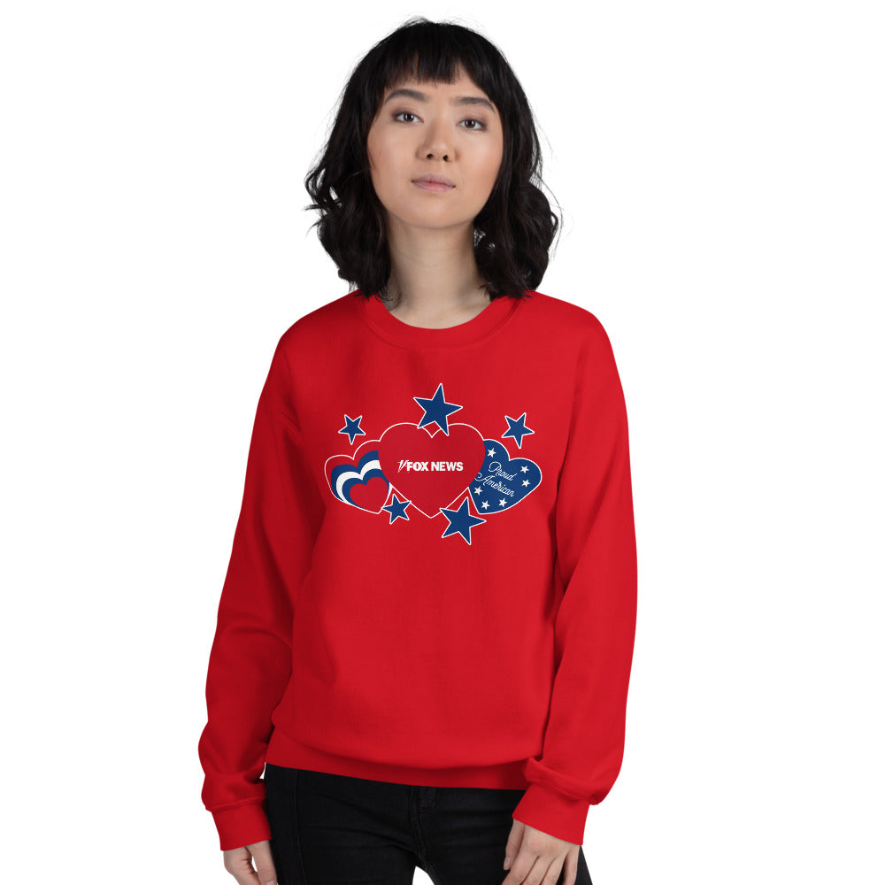 Detail shot of the FOX News logo and patriotic heart graphics prominently displayed on the front of a red crewneck sweatshirt.
