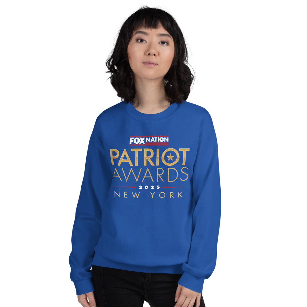 A patriotic American woman wearing the royal blue sweatshirt, reflecting the community of FOX Nation fans.