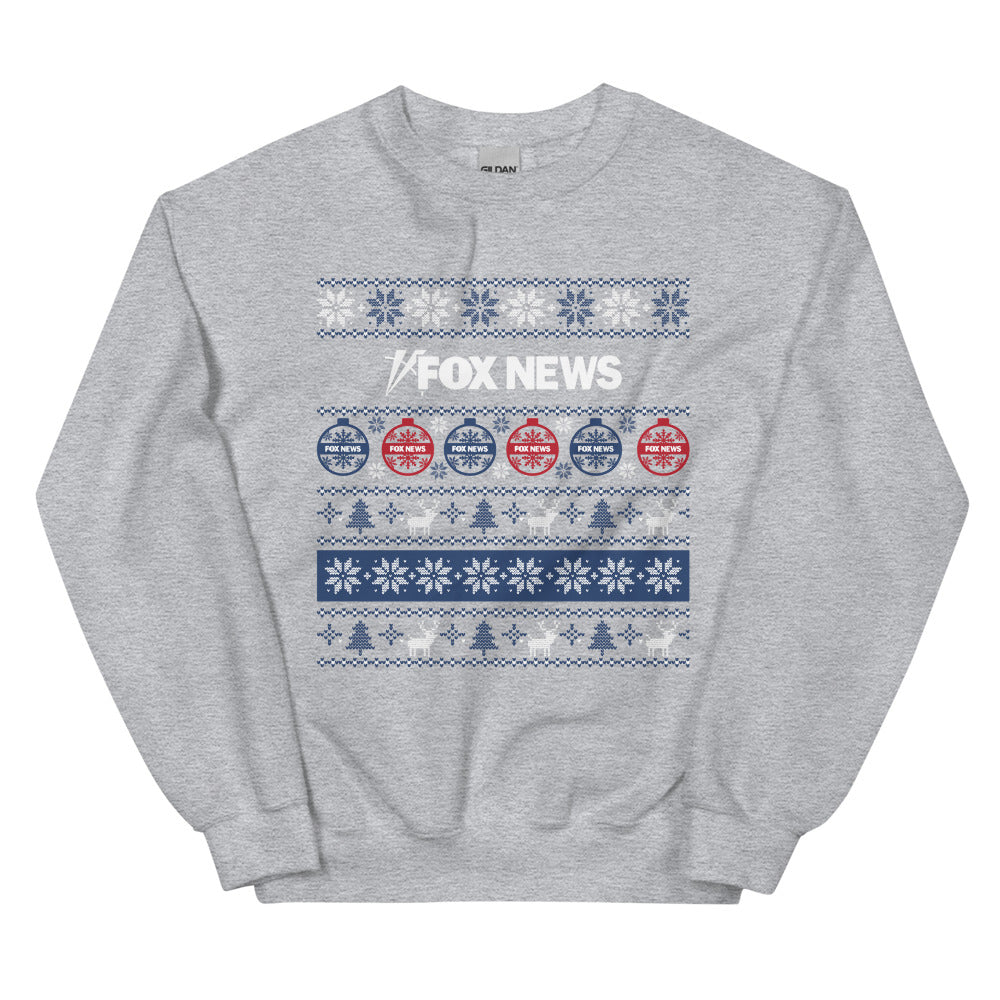 A Sport Grey FOX News Holiday Crewneck Sweatshirt featuring a festive network logo in a clean, modern American living room setting.