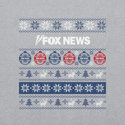 A Sport Grey FOX News Holiday Crewneck Sweatshirt featuring a festive network logo in a clean, modern American living room setting.-1