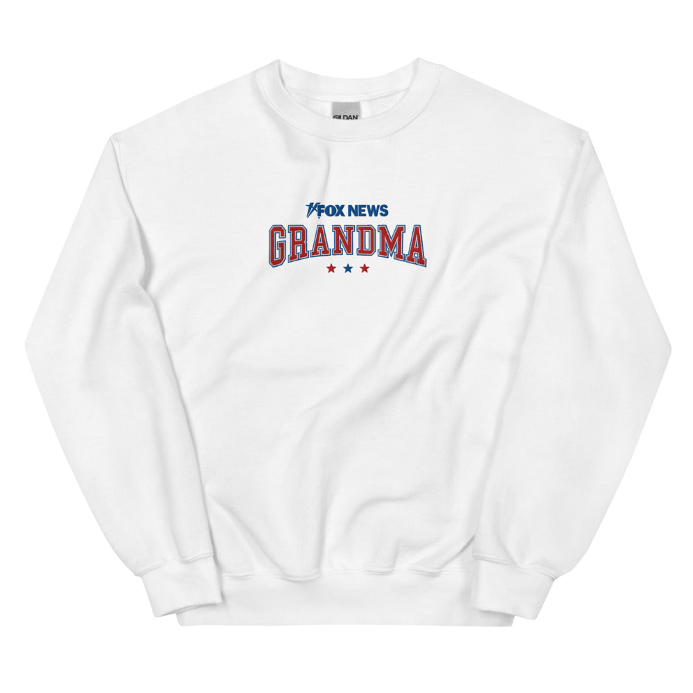 The official FOX News Grandma crewneck sweatshirt in white, featuring a bold graphic design in a clean suburban American home setting.