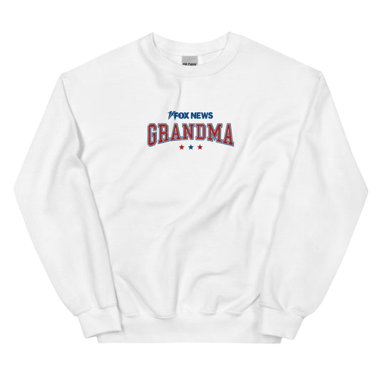 The official FOX News Grandma crewneck sweatshirt in white, featuring a bold graphic design in a clean suburban American home setting.-0