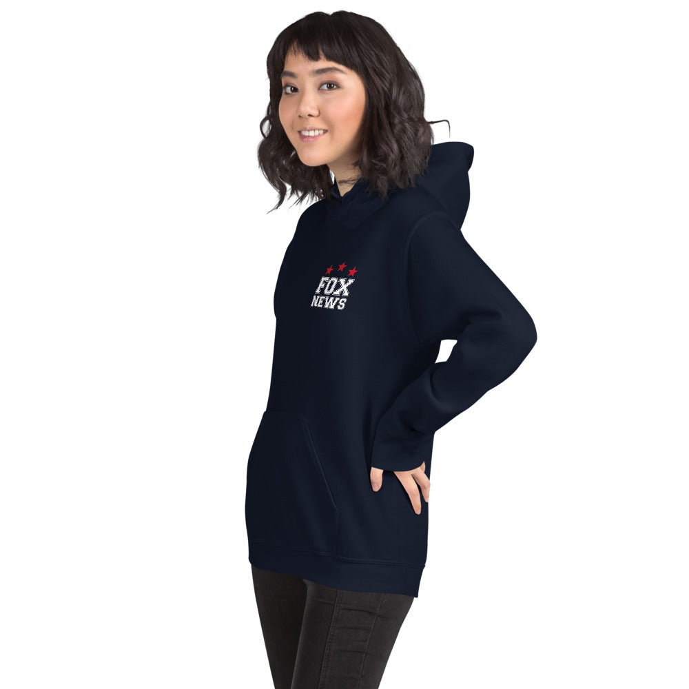 A unisex white FOX News Proud American Hoodie displayed in a bright, suburban American home setting.