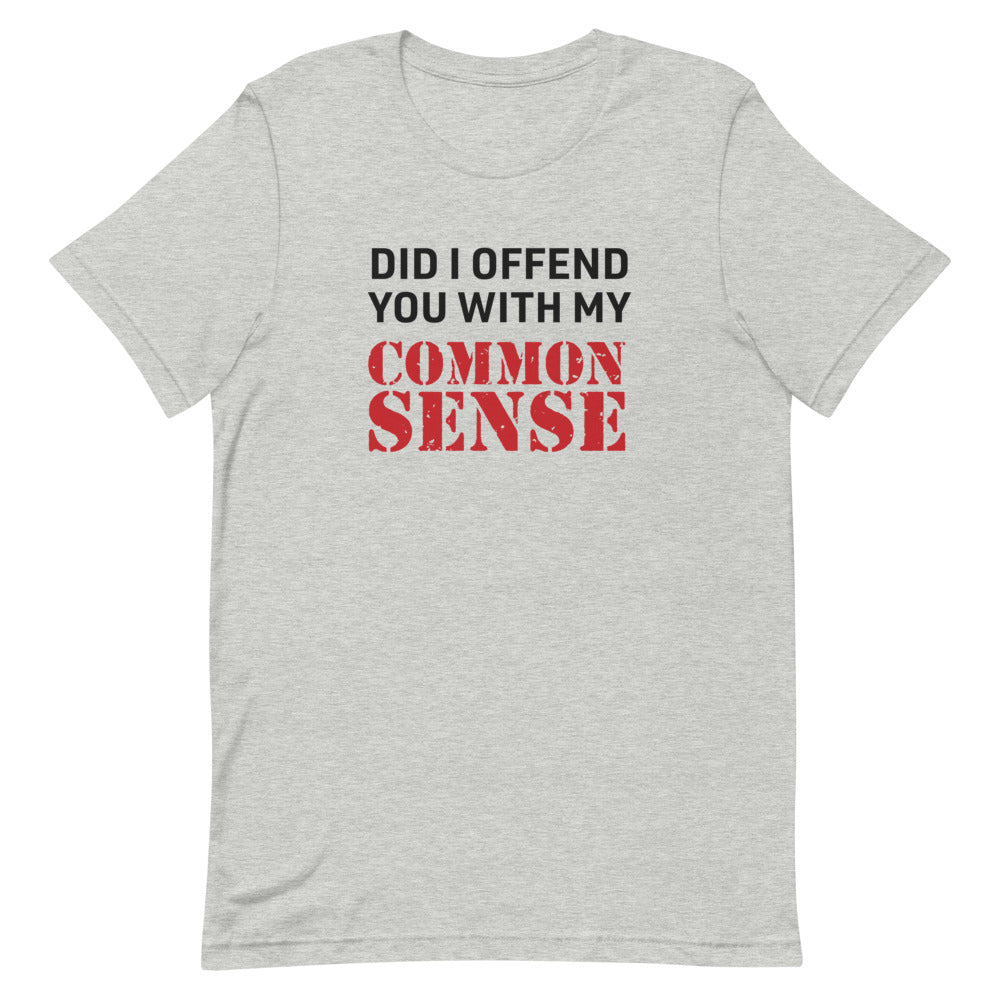 A person wearing the FOX News @ Night Common Sense T-Shirt in a comfortable American suburban backyard.