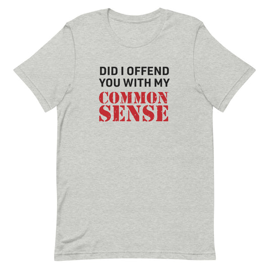 A person wearing the FOX News @ Night Common Sense T-Shirt in a comfortable American suburban backyard.