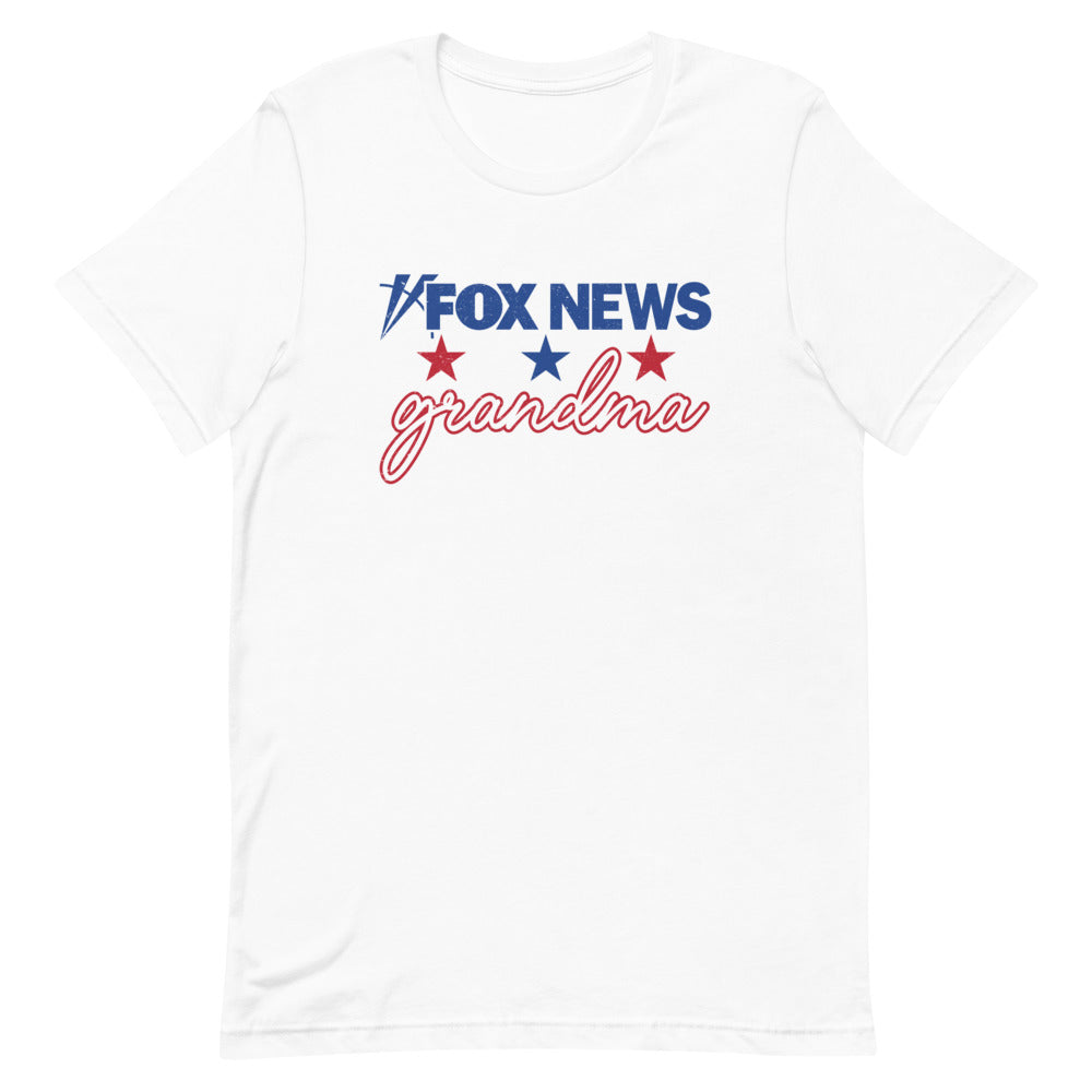 A proud grandmother wearing the FOX News shirt in a comfortable American home setting.