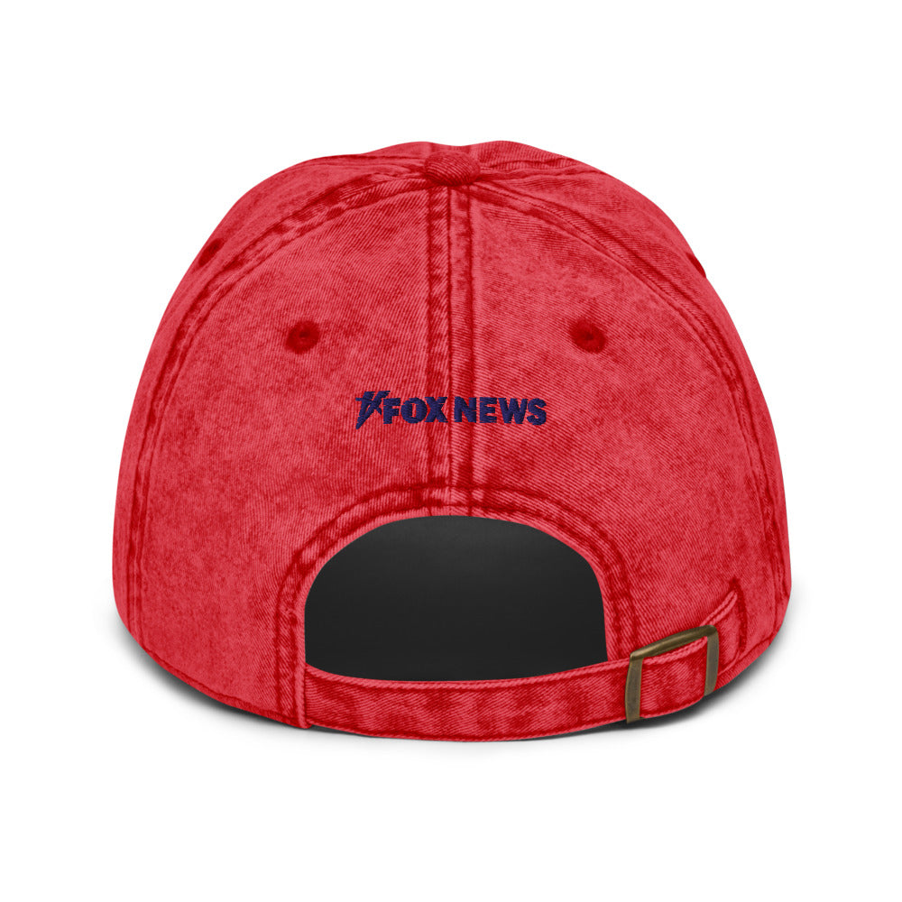 Detailed view of the embroidered logo on the front of the official FOX News baseball cap.