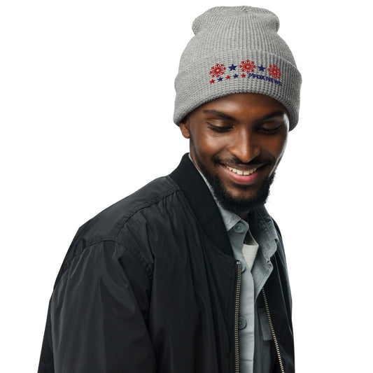 A person wearing the FOX News Holiday Snowflakes Beanie in a cozy American home setting.-4
