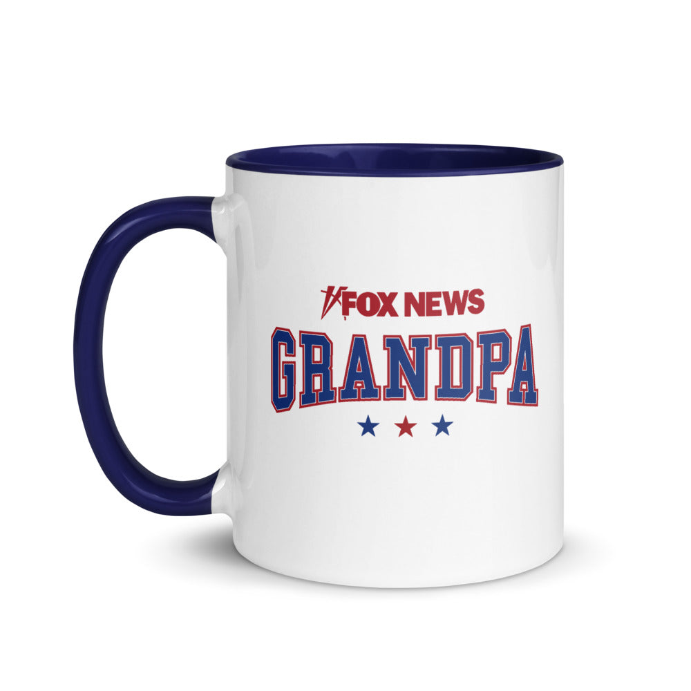 Official *FOX News* Grandpa Two-Tone Mug featuring a white exterior and dark blue handle on a clean kitchen counter.
