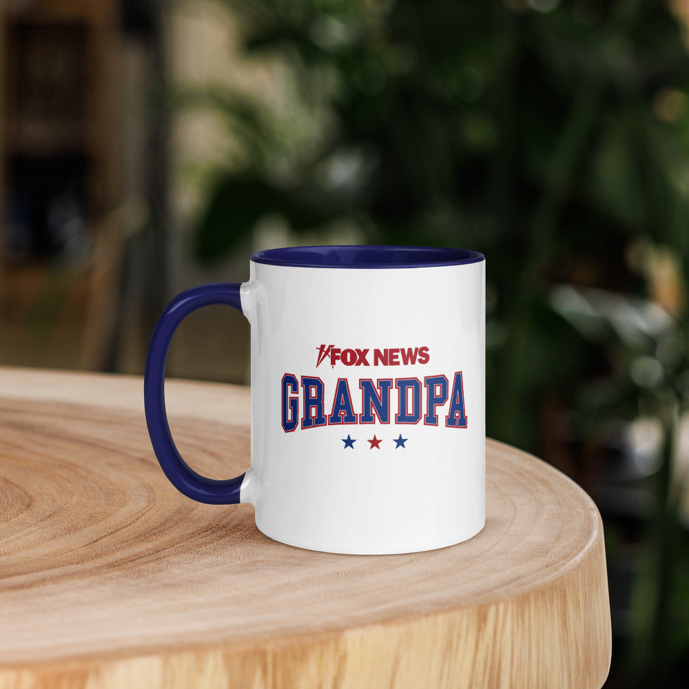A 11 oz *FOX News* Grandpa Mug shown in a comfortable American living room setting.