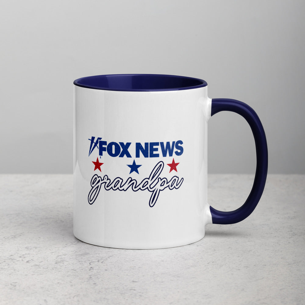 A proud American grandfather holding the FOX News Grandpa two-tone mug in a comfortable, well-lit suburban home environment.