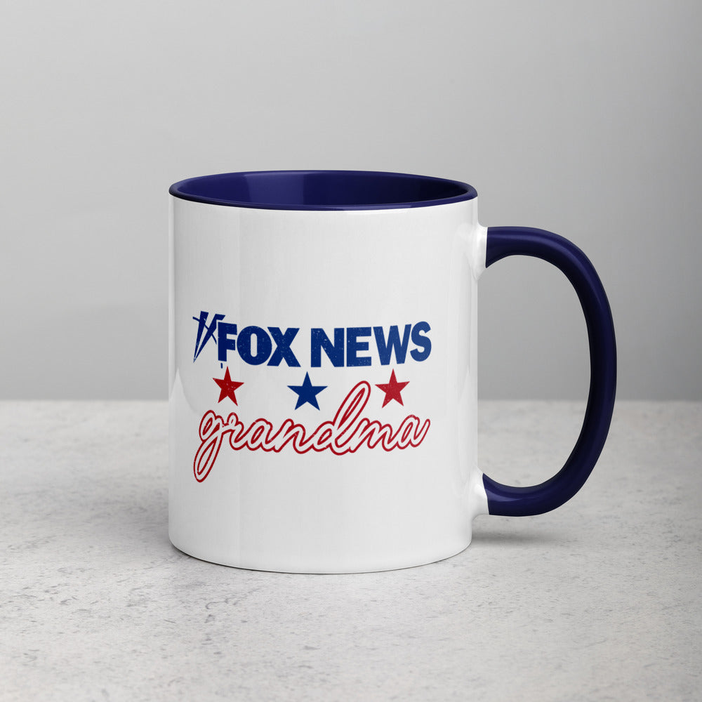 A FOX News Grandma Two-tone Mug with a dark blue interior and handle in a cozy home setting.