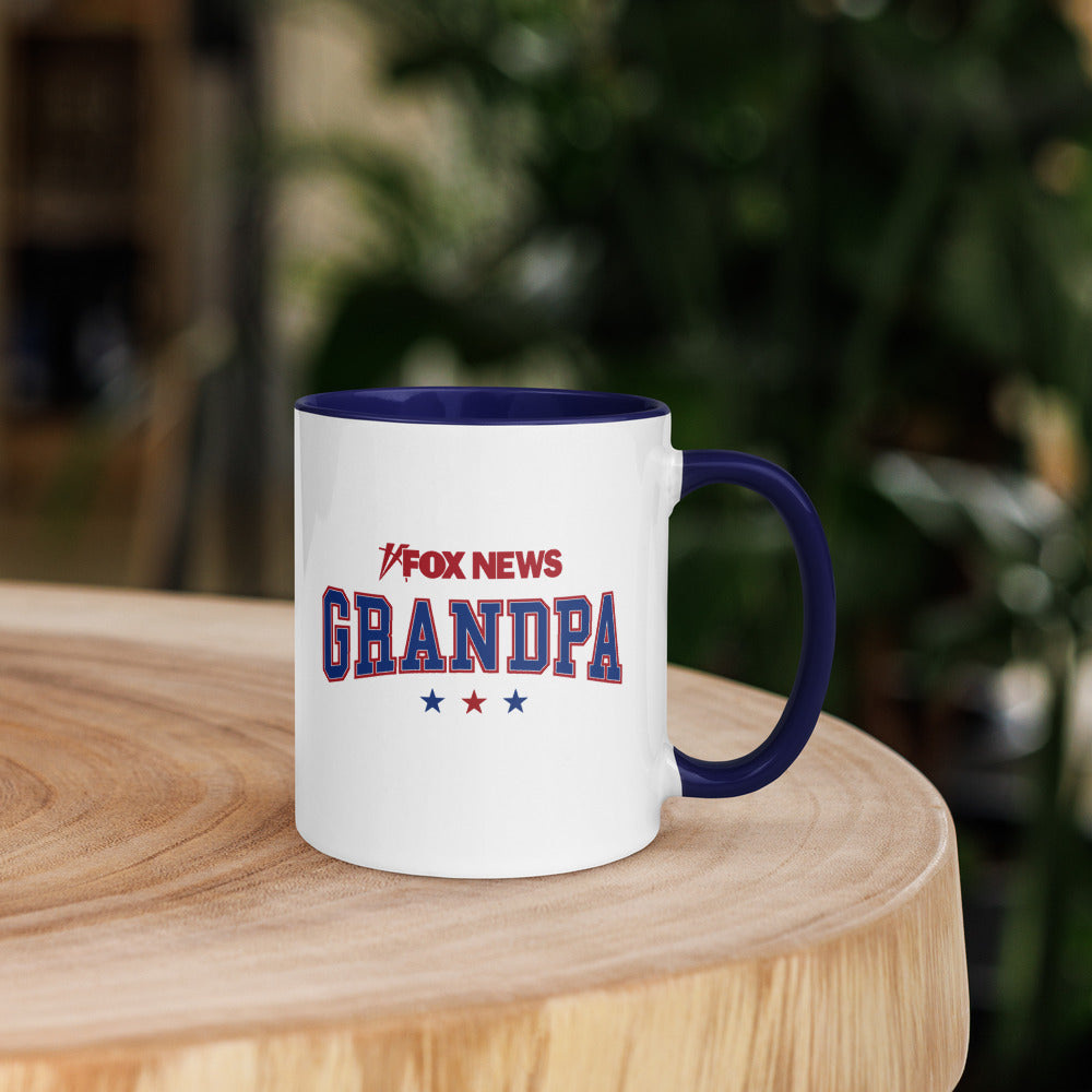 The dark blue interior and handle of the *FOX News* Grandpa Two-Tone Mug clearly displayed.