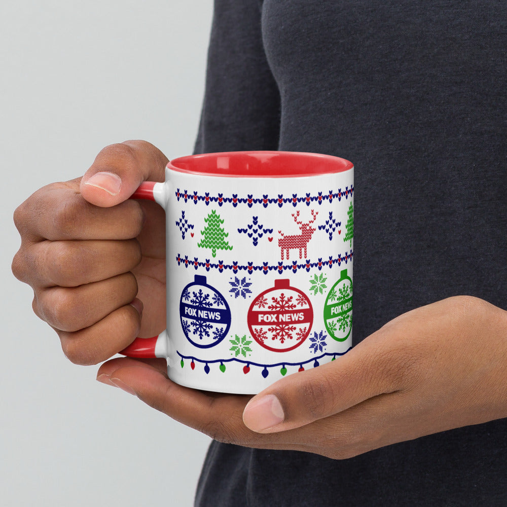 A loyal viewer holding the FOX News Holiday Two-tone Mug while enjoying a morning coffee in a cozy living room.