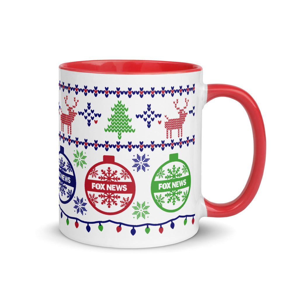 A close-up shot of the FOX News logo prominently displayed on the side of a two-tone ceramic holiday mug.