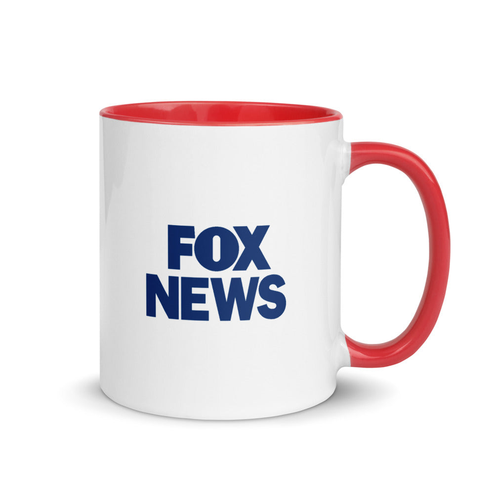 A FOX News hearts two-tone mug sitting on a clean wooden table in a sunlit American kitchen setting.