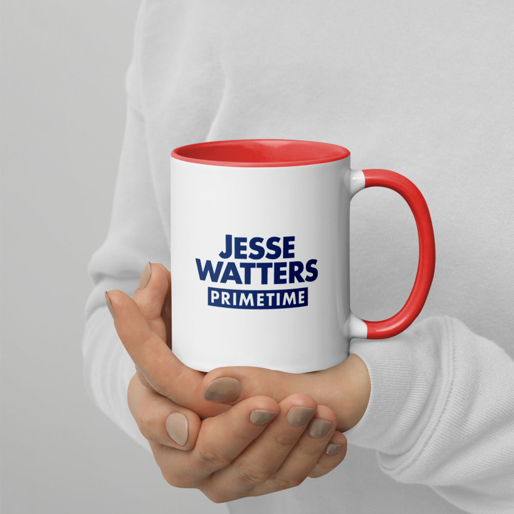 The Jesse Watters Primetime hearts two-tone mug displayed on a wooden desk next to a laptop.