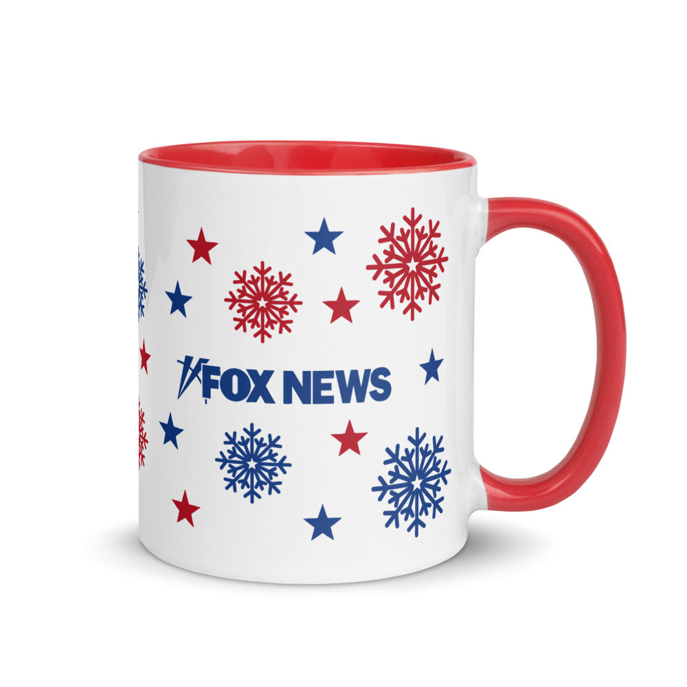 A FOX News Holiday Snowflakes Two Tone Mug with a bright red interior sitting on a clean wooden kitchen table in a suburban American home.