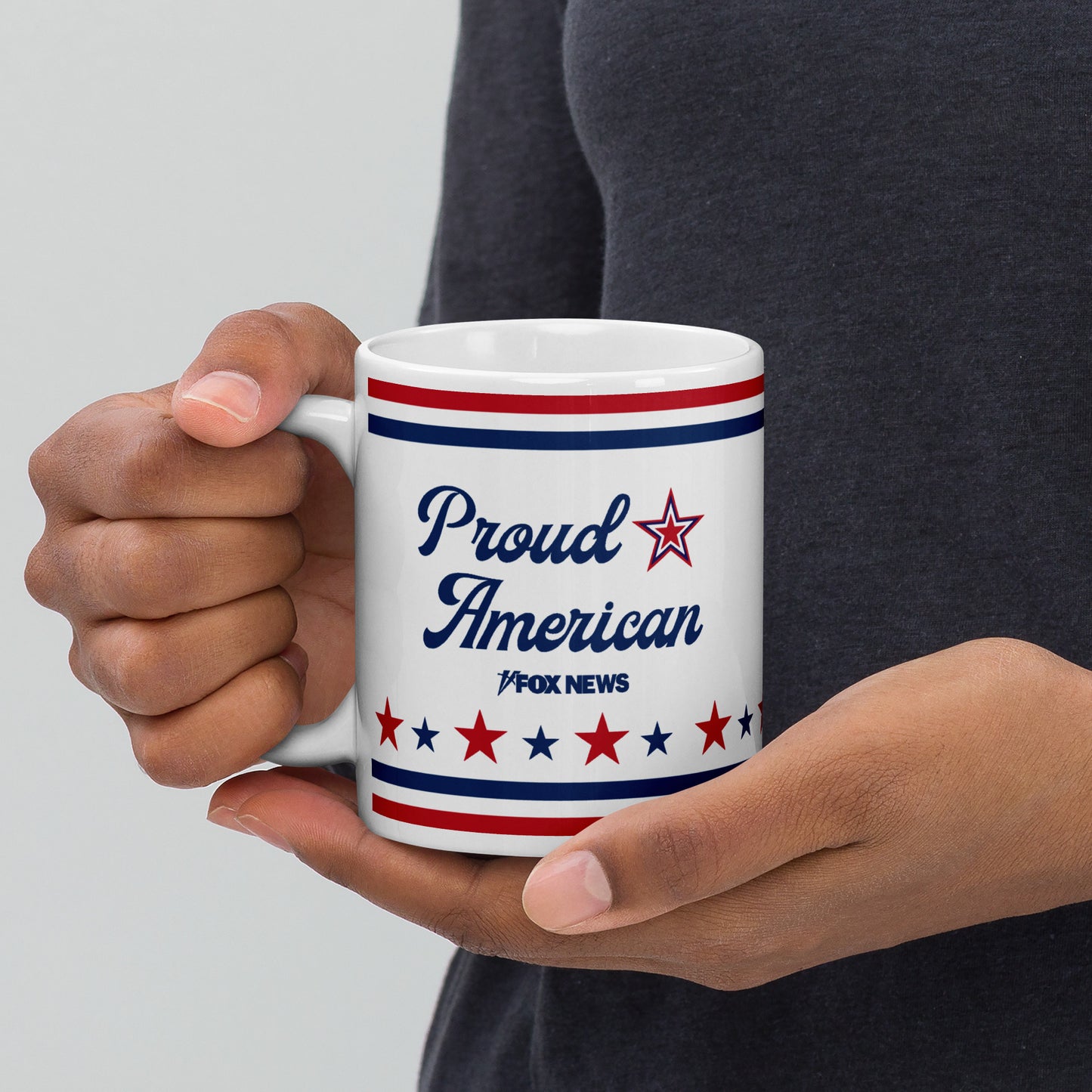 A cozy American living room setting with the FOX News Proud American mug placed beside a morning newspaper on a rustic coffee table.