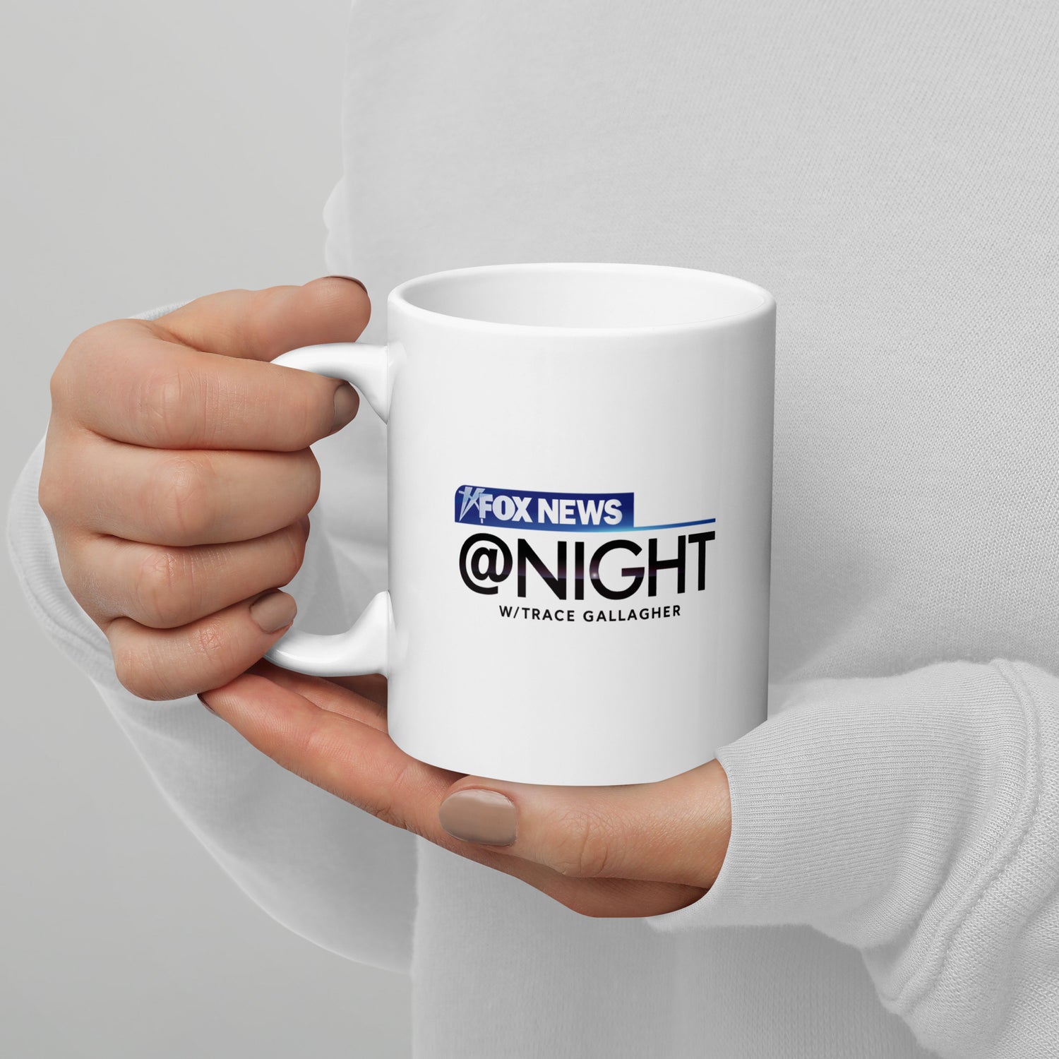 A cozy backyard morning coffee setup featuring the official FOX News @ Night mug.