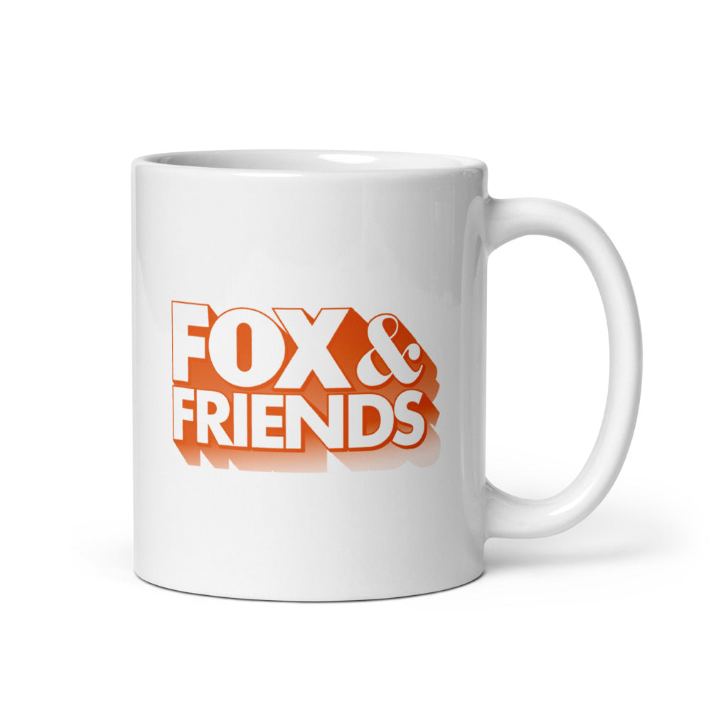 Close-up of the FOX & Friends logo printed clearly on the side of a white ceramic mug in a modern American home setting.