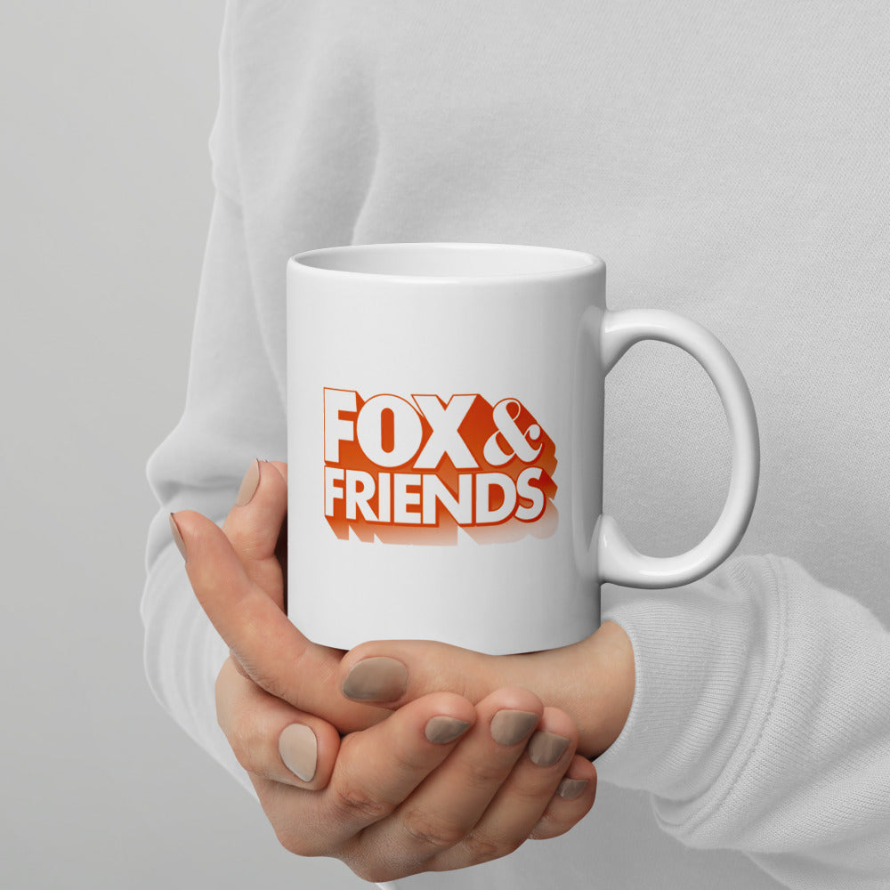 A classic white ceramic mug featuring the FOX News show branding set against a neutral, bright kitchen background.