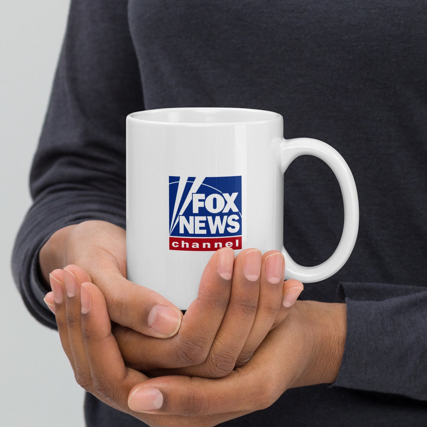 An office desk environment featuring the FOX News 1776 mug next to a notepad, highlighting daily professional use.