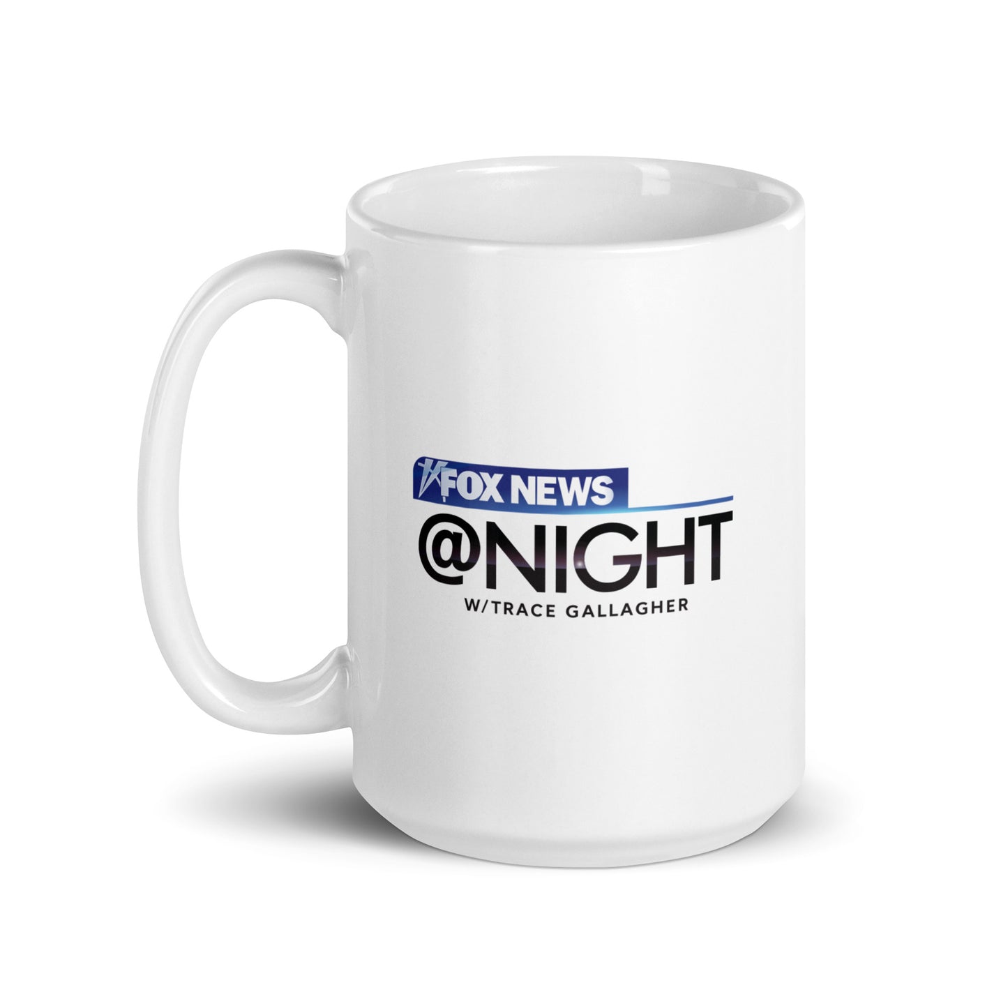 The FOX News @ Night mug presented neatly on a kitchen counter next to a coffee maker.