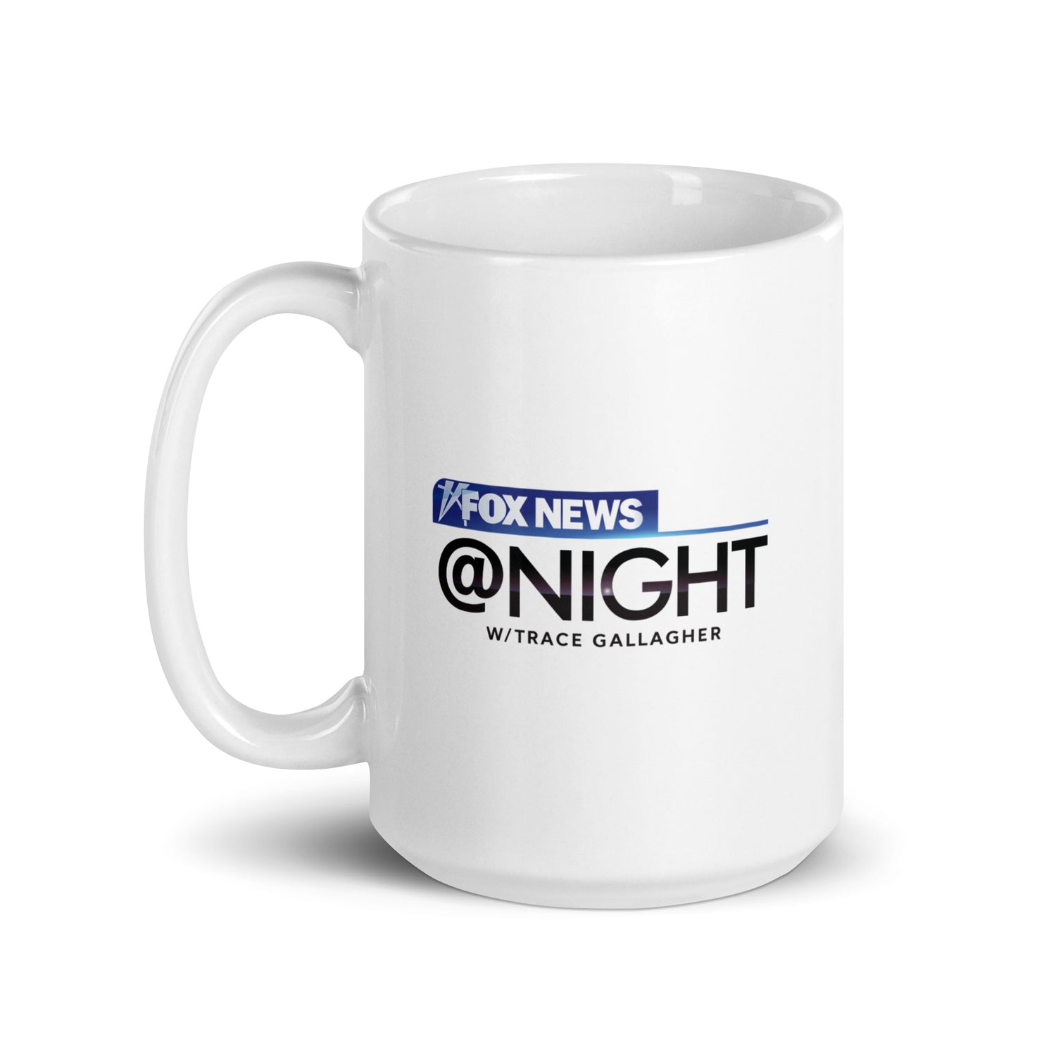 The FOX News @ Night mug presented neatly on a kitchen counter next to a coffee maker.