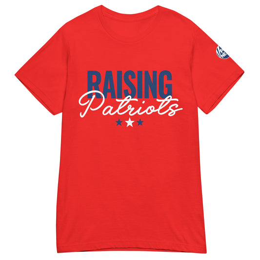 A patriotic woman wearing the red FOX News Raising Patriots T-shirt in a clean American suburban backyard.