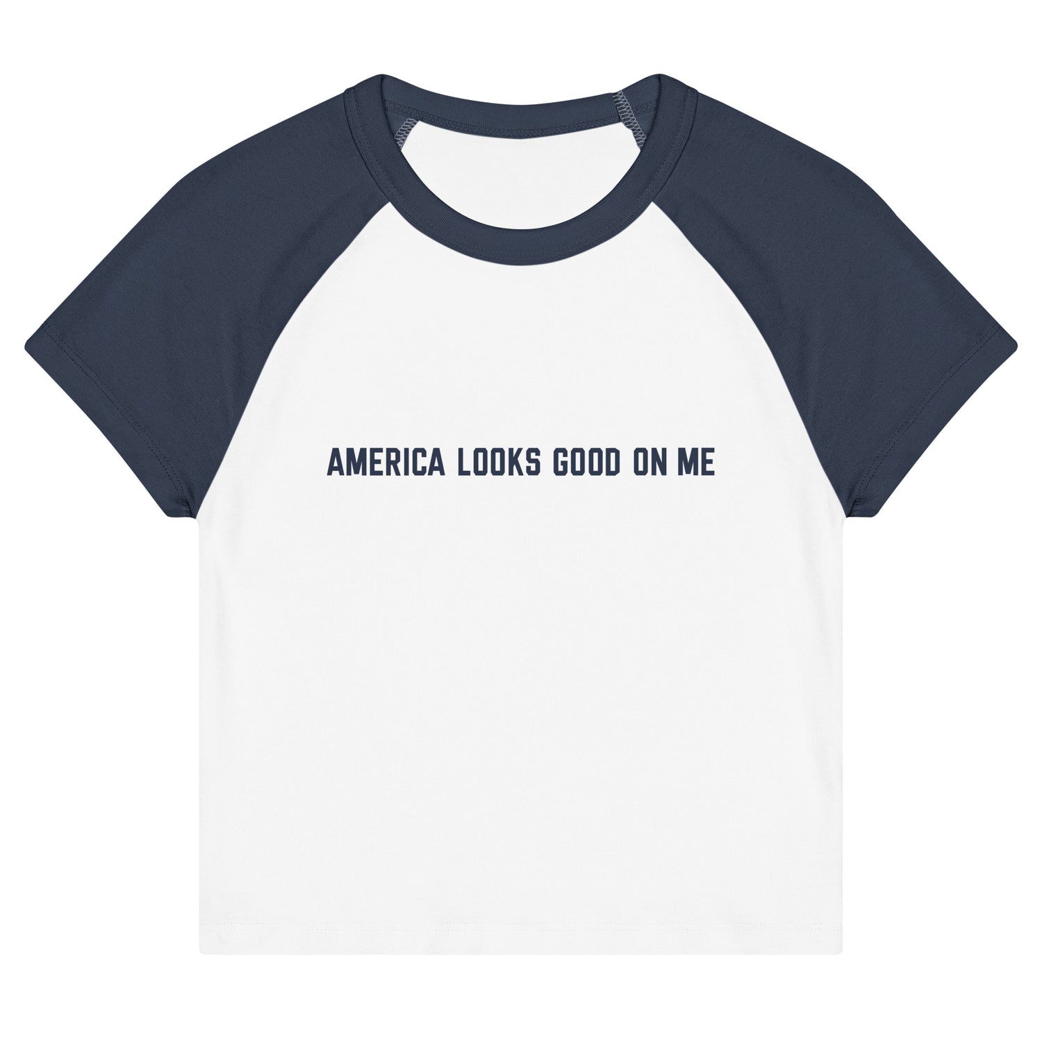 Women's fitted raglan baby tee featuring the red, white, and blue FOX News logo and America Looks Good On Me text across the chest, displayed against a clean American living room setting.