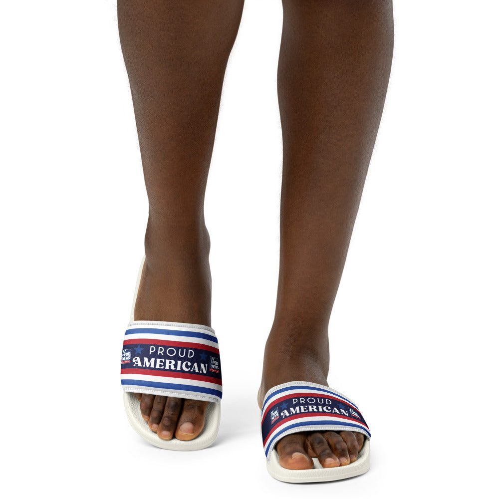 A woman wearing the FOX News patriotic slides while relaxing on a modern suburban porch.