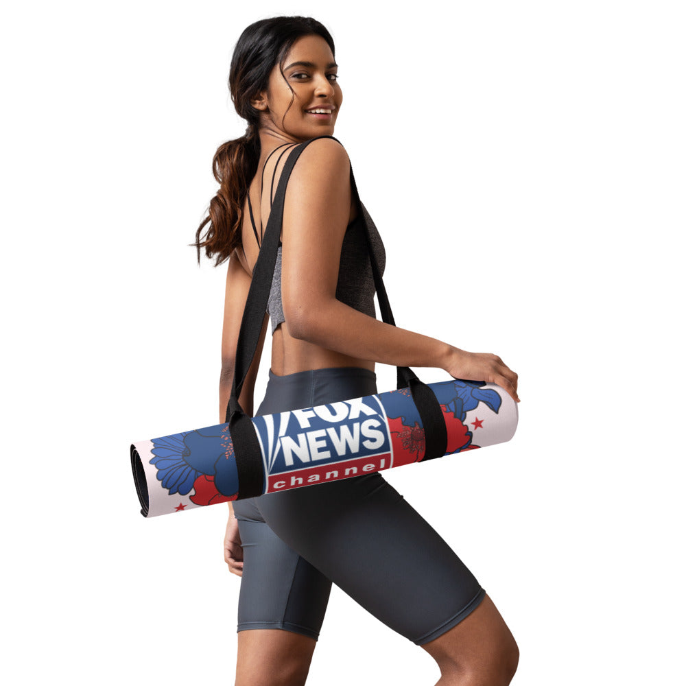 A woman using the FOX News Proud American yoga mat in a bright, sunlit living room.