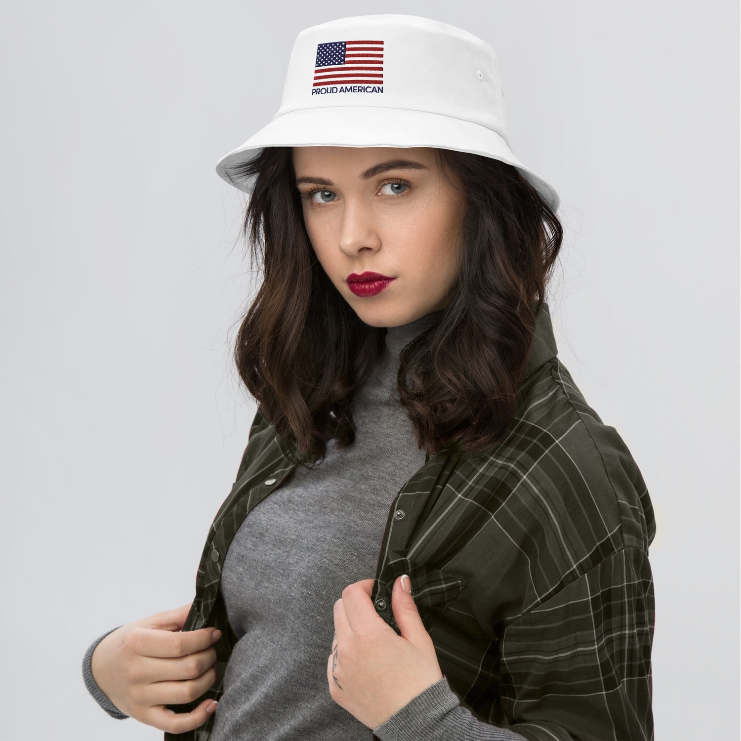 A Caucasian man wearing the white *FOX News* bucket hat in a clean, suburban American backyard setting during a sunny morning.