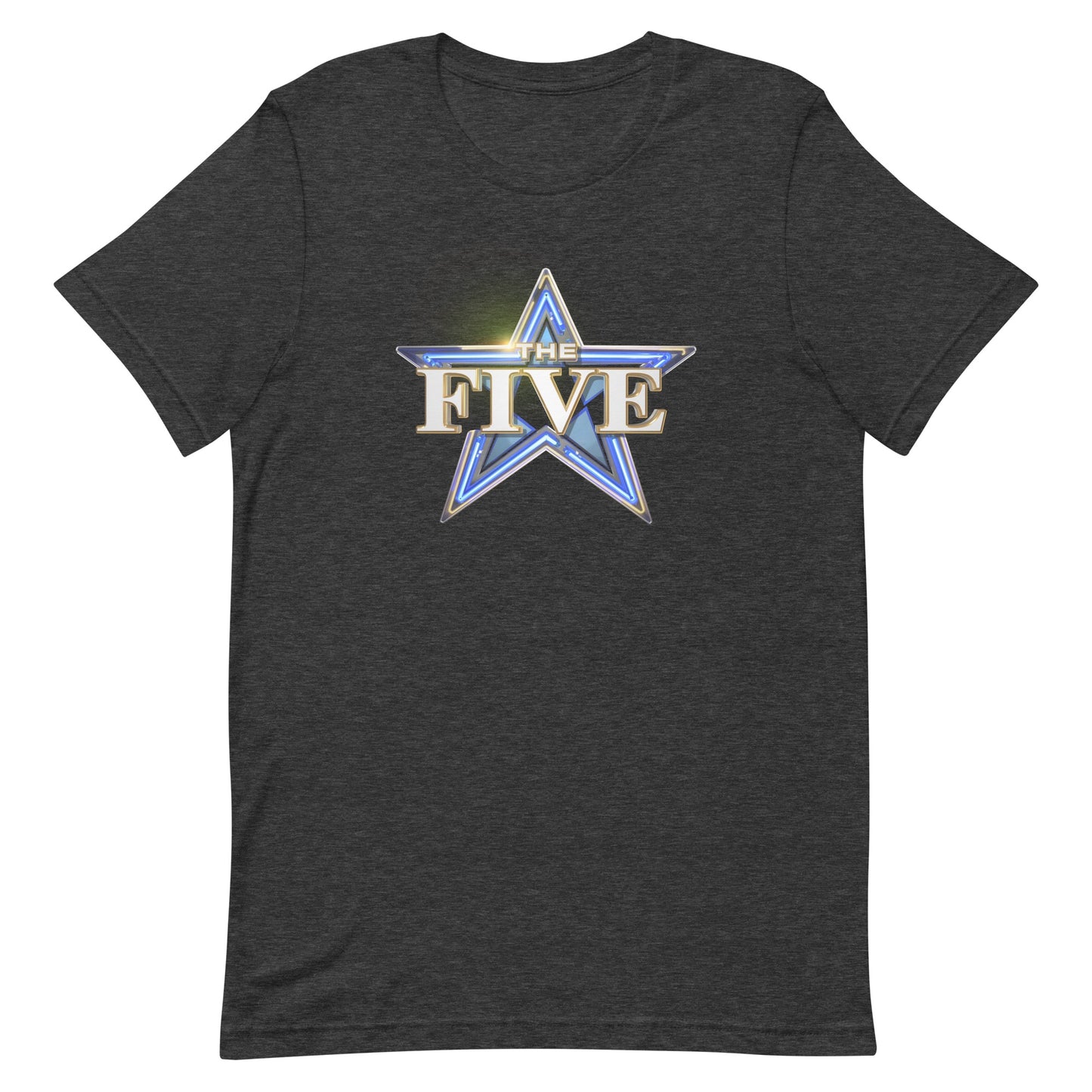 A modern American living room with a neutral-toned sofa, showing a front view of the Dark Grey Heather The Five Logo T-Shirt neatly folded on a coffee table.