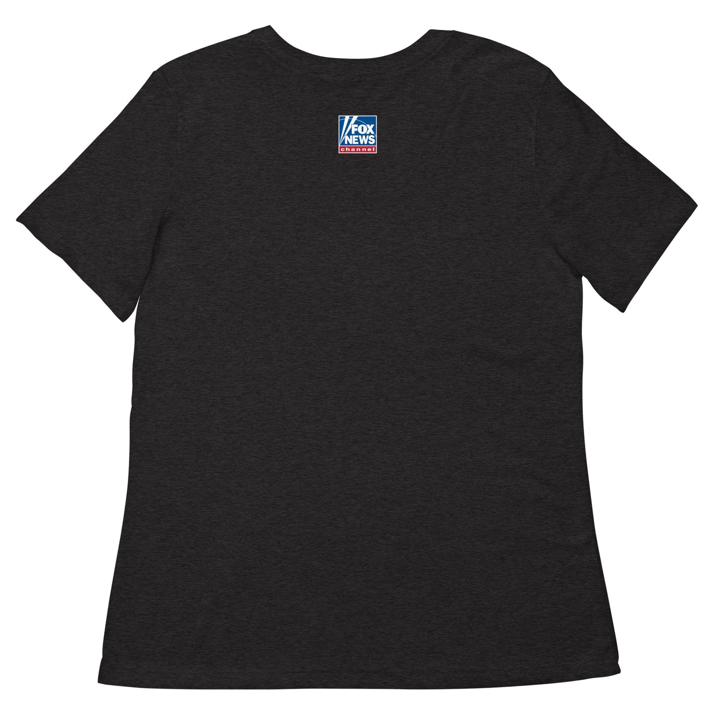 A patriotic female viewer wearing the soft FOX News graphic tee while relaxing in a modern living room setting.