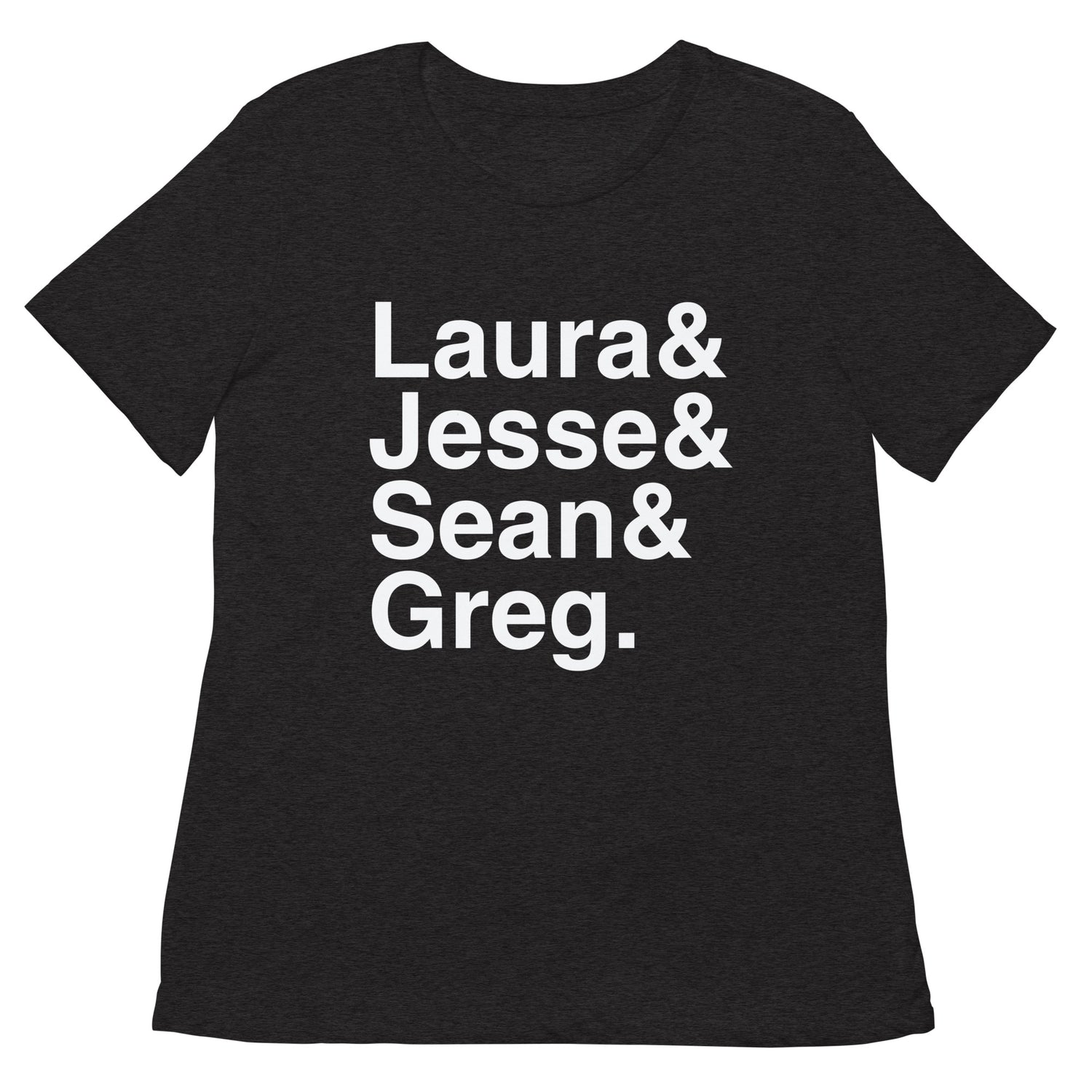 A woman wearing the FOX News Ampersand Women's Tri-Blend T-Shirt in Dark Grey Heather, standing in a bright, clean American suburban home setting.