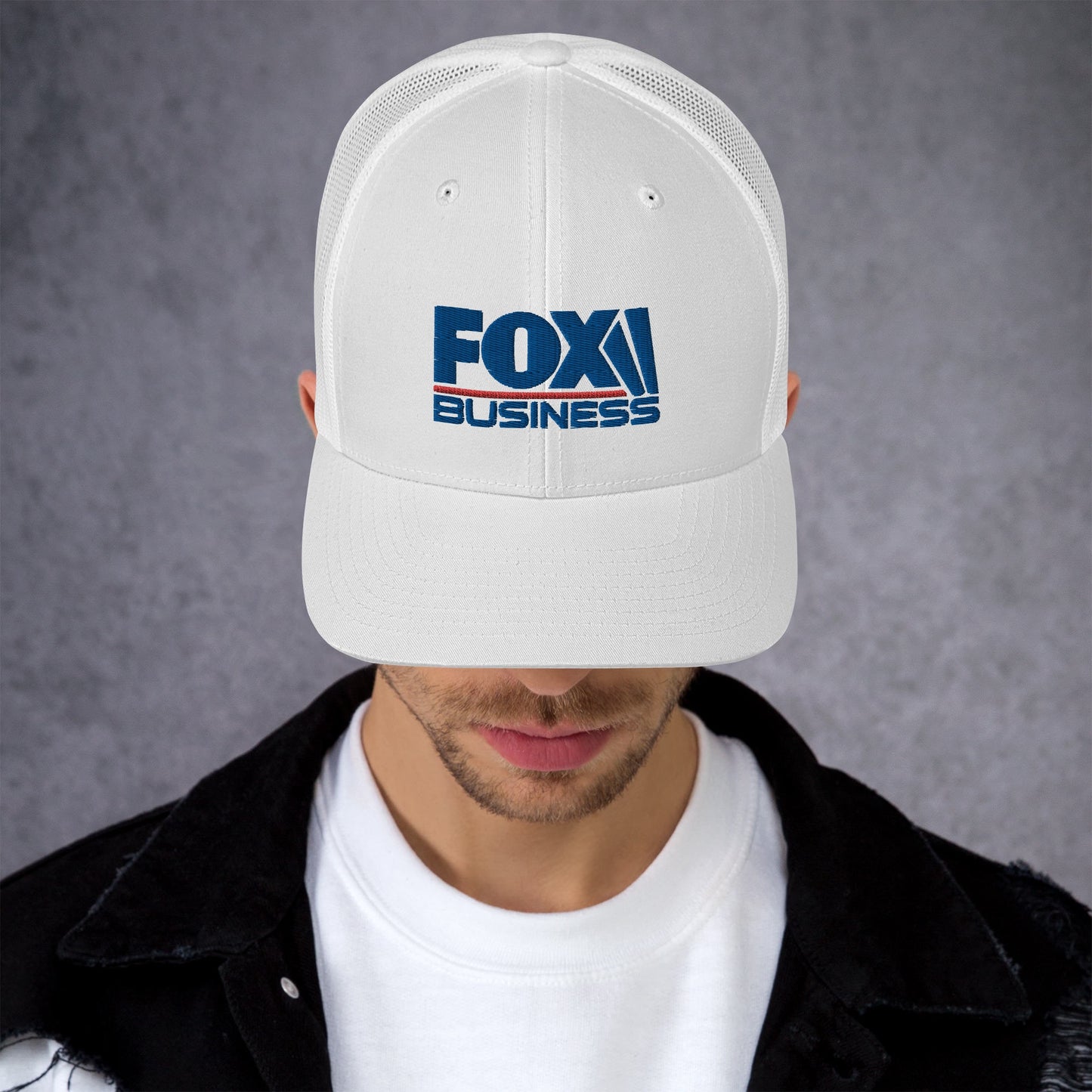 The FOX Business logo hat resting on a wooden table in a bright, modern American home setting.