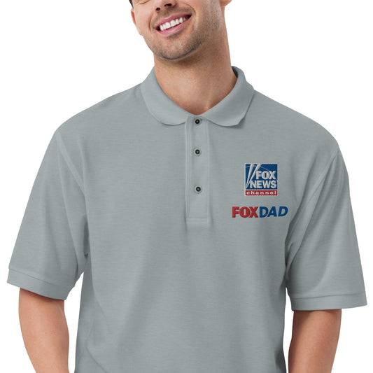 A modern American living room with warm lighting, showcasing the FOX News Dad Embroidered Polo Shirt neatly displayed on a neutral surface.