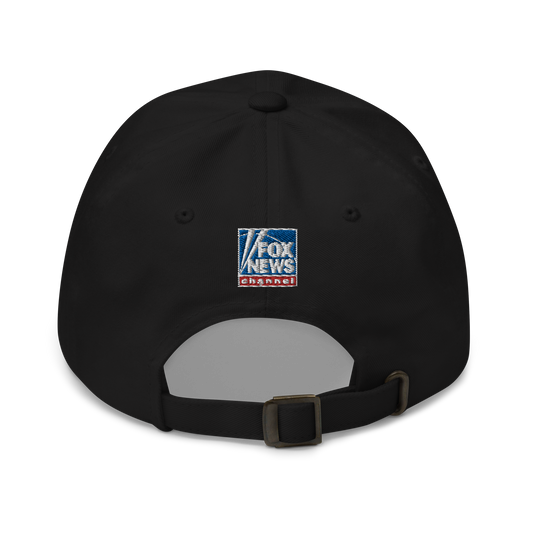 The white FOX News Fox Dad Classic Dad Hat displayed on a table in a bright American home setting.