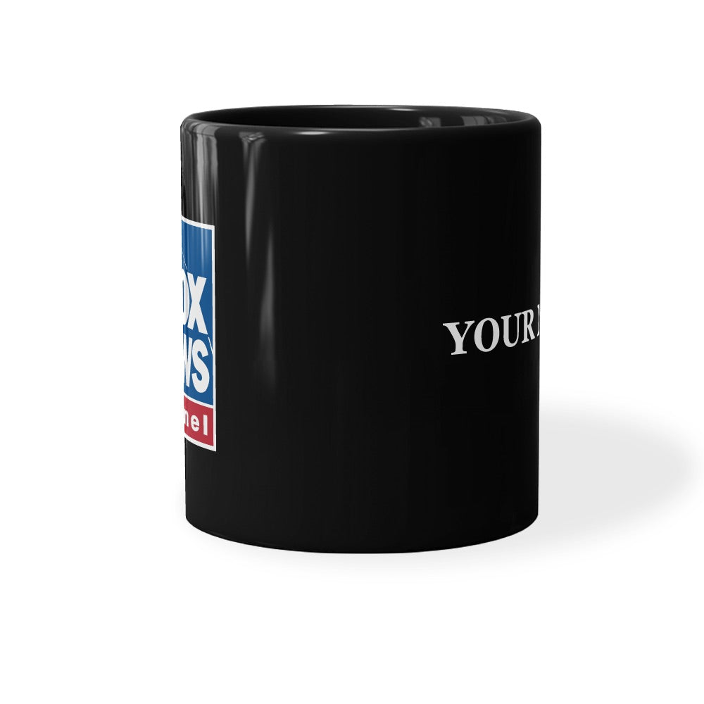 The FOX News Logo Personalized Black Mug displayed on a wooden desk next to a laptop in a clean home office.