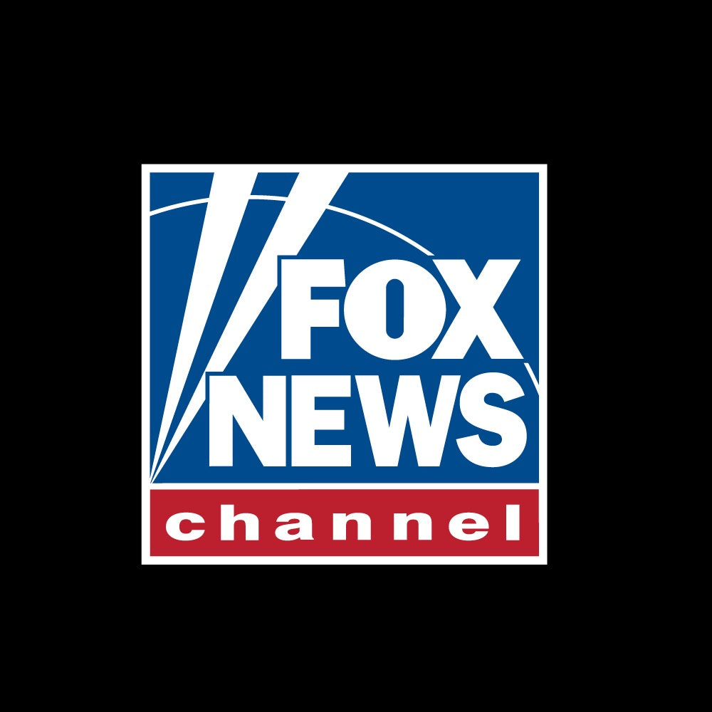 A loyal Caucasian viewer enjoying coffee in the FOX News Logo Personalized Black Mug in a bright American kitchen.