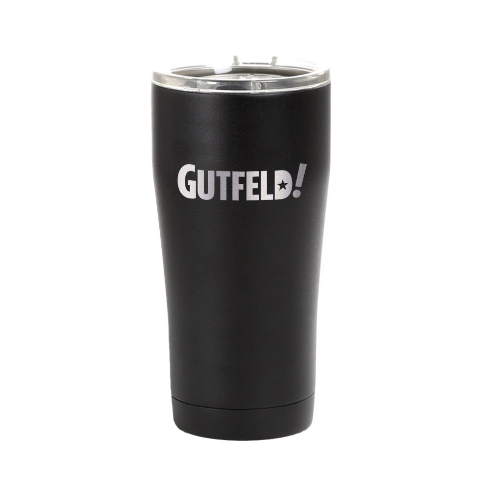 A Gutfeld! Logo Black Tumbler featuring the bold white show logo on a sleek matte black finish in a clean American kitchen setting.