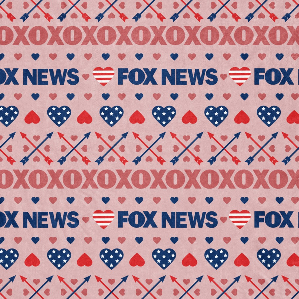 The FOX News Heart Sherpa Blanket displayed in a bright, suburban American home environment.
