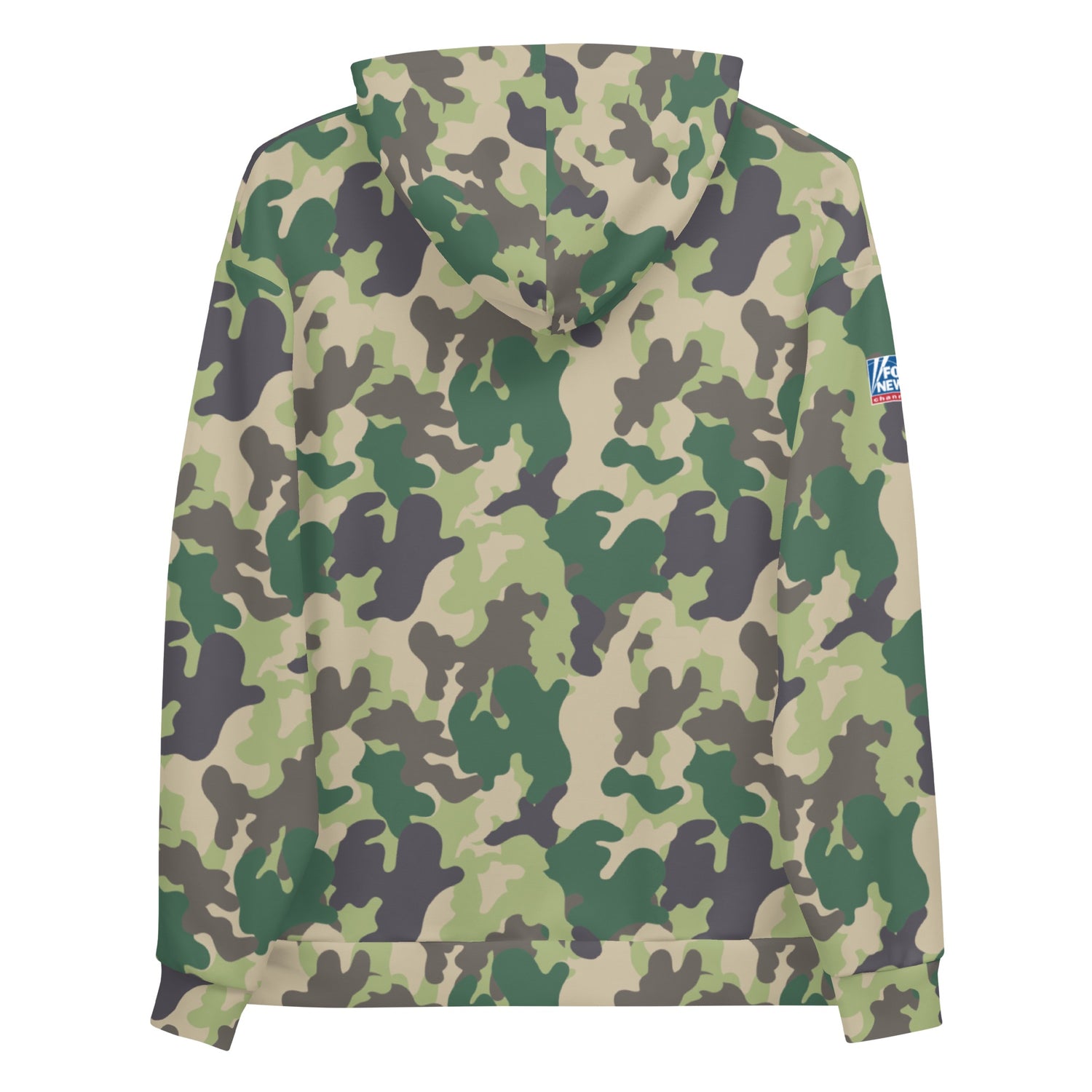 A person wearing the FOX News camo hoodie in a comfortable, suburban backyard setting during a crisp morning.