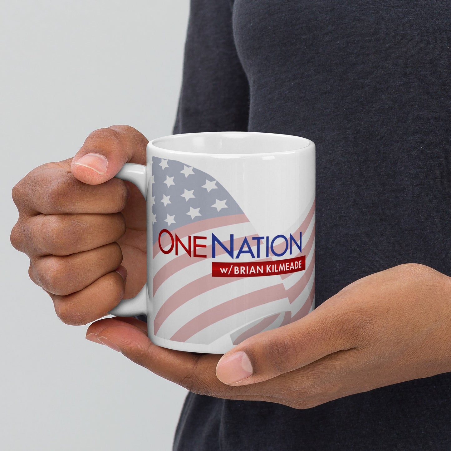 The FOX News One Nation with Brian Kilmeade White Mug displayed on a tidy office desk next to a morning newspaper.