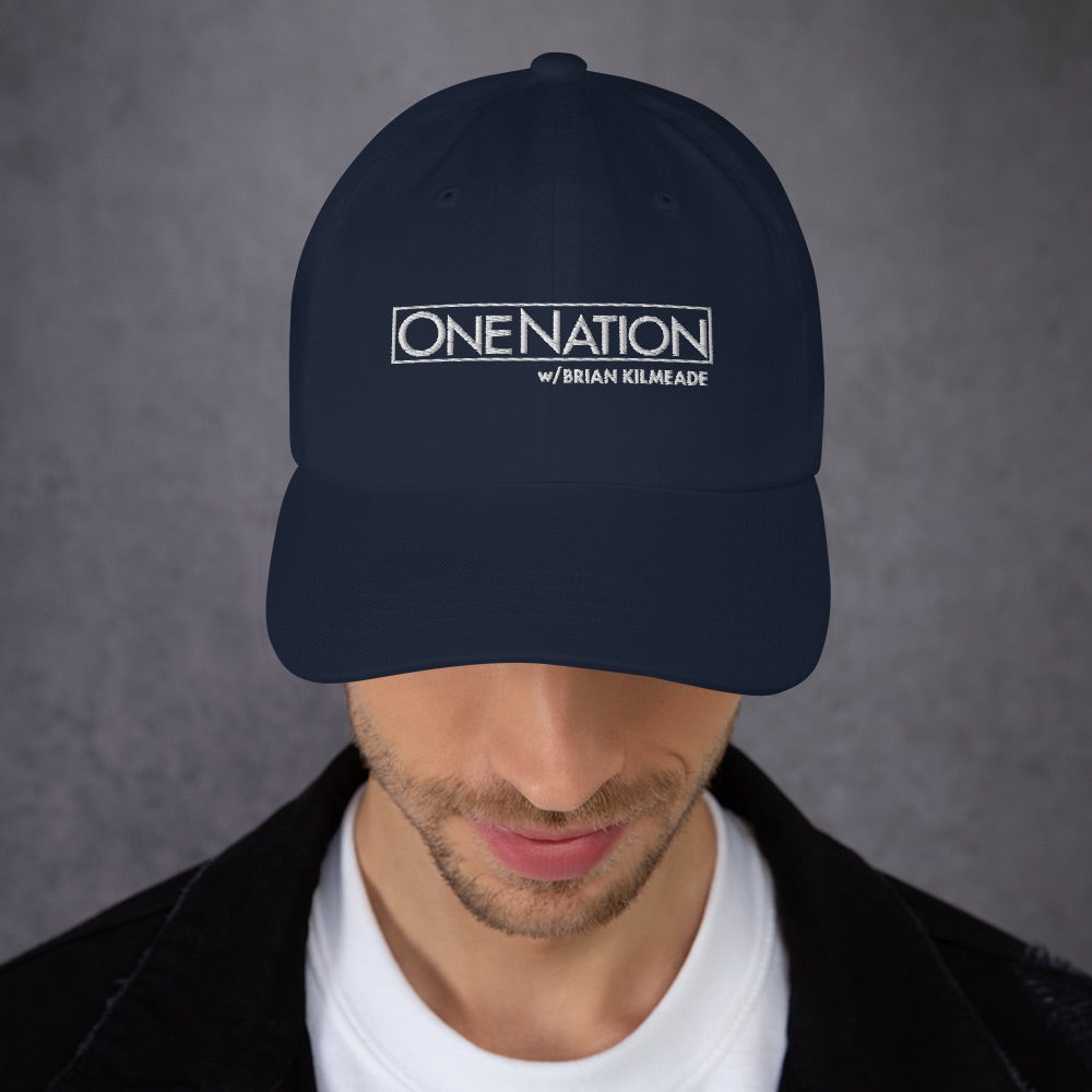 A lifestyle context shot of the hat styled for a weekend outdoor walk in a classic American suburban neighborhood.